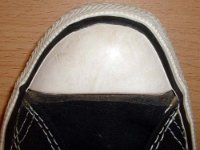 1970s Black High Top Chucks  Close up of the left toe cap of a 1970s black high top.
