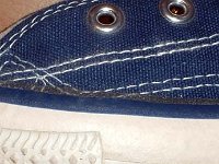 1970s Blue High Top Chucks  Close up of the left side outer stitching of a left 1970s navy blue high top.
