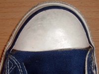 1970s Blue High Top Chucks  Close up of the left toe cap on a pair of 1970s navy blue high tops.
