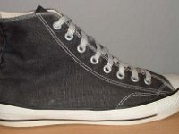 1980s Black High Top Chucks  Outside view of a right 1980s black high top.