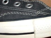 1980s Black High Top Chucks  Close up of the outer stitching on the right side of a right 1980s black high top.