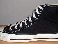 Early 1990s Black High Top Chucks  Outside view of a left early 1990s black high top.