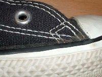 Early 1990s Black High Top Chucks  Close up of the outer stitching on the right side of a left early 1990s black high top.