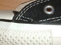 Early 1990s Black High Top Chucks  Close up of the outer stitching on the left side of a right early 1990s black high top.