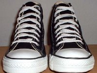 Late 1990s Black High Top Chucks  Front view of late 1990s black high tops.
