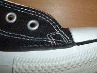 Late 1990s Black High Top Chucks  Closeup of the outer stitching on the right side of a right late 1990s black high top.