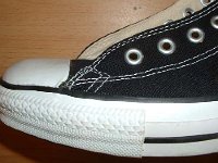 Late 1990s Black High Top Chucks  Closeup of the outer stitching on the left side of a Left late 1990s black high top.