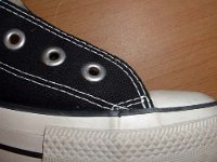 2002 Made in Viet Name Black High Tops  Close up of the outer stitching from the right side of a right made in Viet Nam black high top.