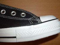 2005 Made in China Black High Top Chucks  Close up of the outer stitching on the right side of a left made in China black high top.