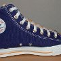 2-Tone Chucks  New purple and gold 2-tone high top, left inside patch view.