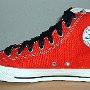 2-Tone Chucks  Red and black right 2-tone high top with wide black laces, inside patch view.