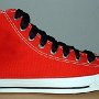 2-Tone Chucks  Right red and black 2-tone high top with wide black laces, outside view.