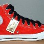 2-Tone Chucks  Left red and black 2-tone high top, new with tag and wide black laces, inside patch view.