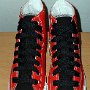 2-Tone Chucks  Red and black 2-tone high tops, new with tag and wide black laces, top view.