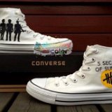 5 Seconds of Summer  White pair of tribute high top chucks.