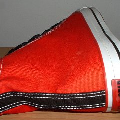 Red/Black 2-Tone High Top Chucks  Right red and black 2-tone high top, rear patch and outside view.