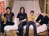 All American Rejects  The All American Rejects lay on a bed wearing their chucks and looking at the camera.