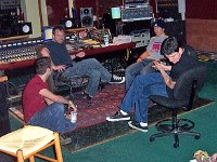 Allister  The band members sit in a recordng studio bouncing ideas off each other.