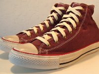 Washed Andorra Red High Top Chucks  Angled side view of washed Andorra red high top chucks.
