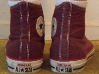 Washed Andorra Red High Top Chucks  Wearing washed Andorra red high top chucks, rear view 1.
