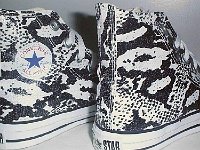 Chucks With Animal Print Uppers  Snakeskin pattern high tops, showing partial inside patch and outside views.