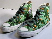 Chucks With Animal Print Uppers  Conosaur (dinosaur) pattern high tops with olive green laces, angled top and side views.