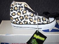 Chucks With Animal Print Uppers  Leopard print high top that glows in the dark.