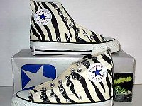 Chucks With Animal Print Uppers  Glow in the dark zebra print high tops, inside patch views.