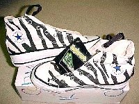 Chucks With Animal Print Uppers  Zebra print high tops that glow in the dark, inside patch and top views.