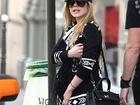 Avril Lavigne  Avril on the street wearing black low cut chucks.