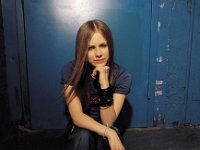 Avril Lavigne  Avril seated on a doorstep.