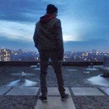 Austin Asher Stills From Shazam!  With his foster family in danger, Billy looks over Philadelphia from the rooftop of his mother's apartment building.