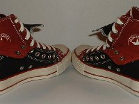 Black and Brick Red Double Upper High Top Chucks  Angled rear view of folded down black and brick red double upper high tops.