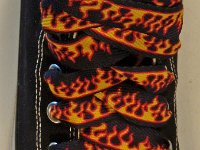 Black Flames Shoelaces for Chucks  Black flames print shoelace on a black high top.