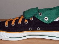 Black, Green, and Amber Foldover High Top Chucks  Inside patch view of a right black, green, amber foldover rolled down to the sixth eyelet.
