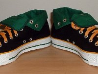 Black, Green, and Amber Foldover High Top Chucks  Angled front view of black, green, amber foldovers rolled down to the sixth eyelet.