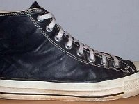 Black Leather High Top Chucks  Right black leather high top, outside view.