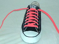 Black Low Cut Oxford Chucks  Brand new black low cuts with neon pink laces, front and top view.