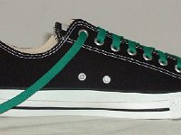 Black Low Cut Oxford Chucks  Brand new black low cut with kelly green laces, side view.