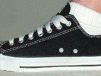 Black Low Cut Oxford Chucks  Wearing brand new black low cut with wide laces, side view.