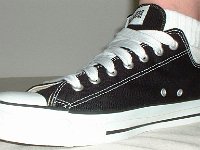 Black Low Cut Oxford Chucks  Brand new black low cut with wide laces, angled side view.
