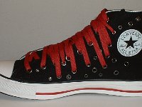 Black and Red Multiple Eyelet High Top Chucks  Inside patch view of a right black and red multiple eyelet high top.