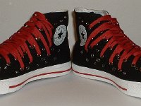 Black and Red Multiple Eyelet High Top Chucks  Angled front view of black and red multiple eyelet high tops.