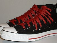Black and Red Multiple Eyelet High Top Chucks  Angled side view of black and red multiple eyelet high tops.