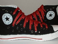 Black and Red Multiple Eyelet High Top Chucks  Inside patch views of black and red multiple eyelet high tops.