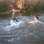 People Wearing Black Chucks  Floating downstream.