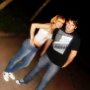 People Wearing Black Chucks  Couple posing in an attic.