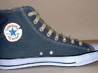 Blue Denim Distressed Graphic Star High Top Chucks  Left blue denim graphic star high top, inside patch view.