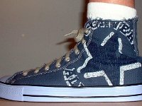 Blue Denim Distressed Graphic Star High Top Chucks  Wearing blue denim graphic star high tops, left outside view.