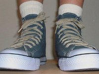 Blue Denim Distressed Graphic Star High Top Chucks  Wearing blue denim graphic star high tops, front view.